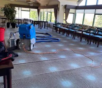 Commercial carpet being cleaned in a hotel function room