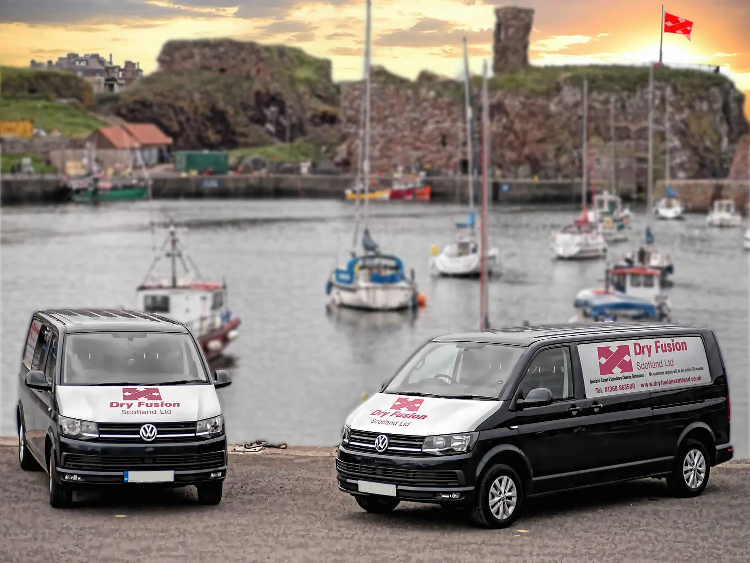 Dry Fusion vans at Dunbar harbour with Dunbar Castle behind