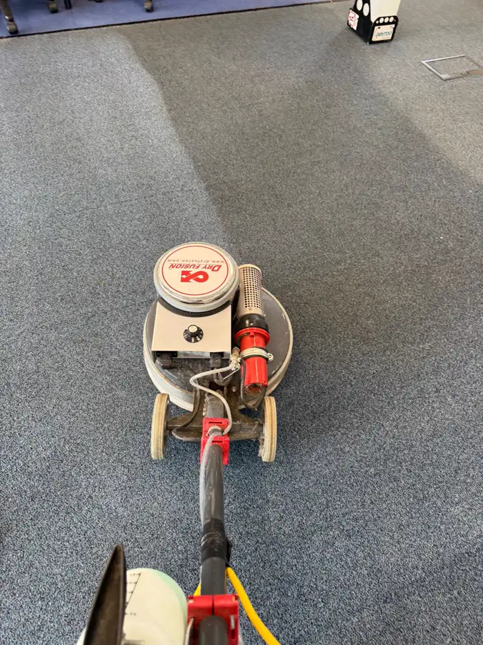 Dry Fusion machine cleaning an office carpet